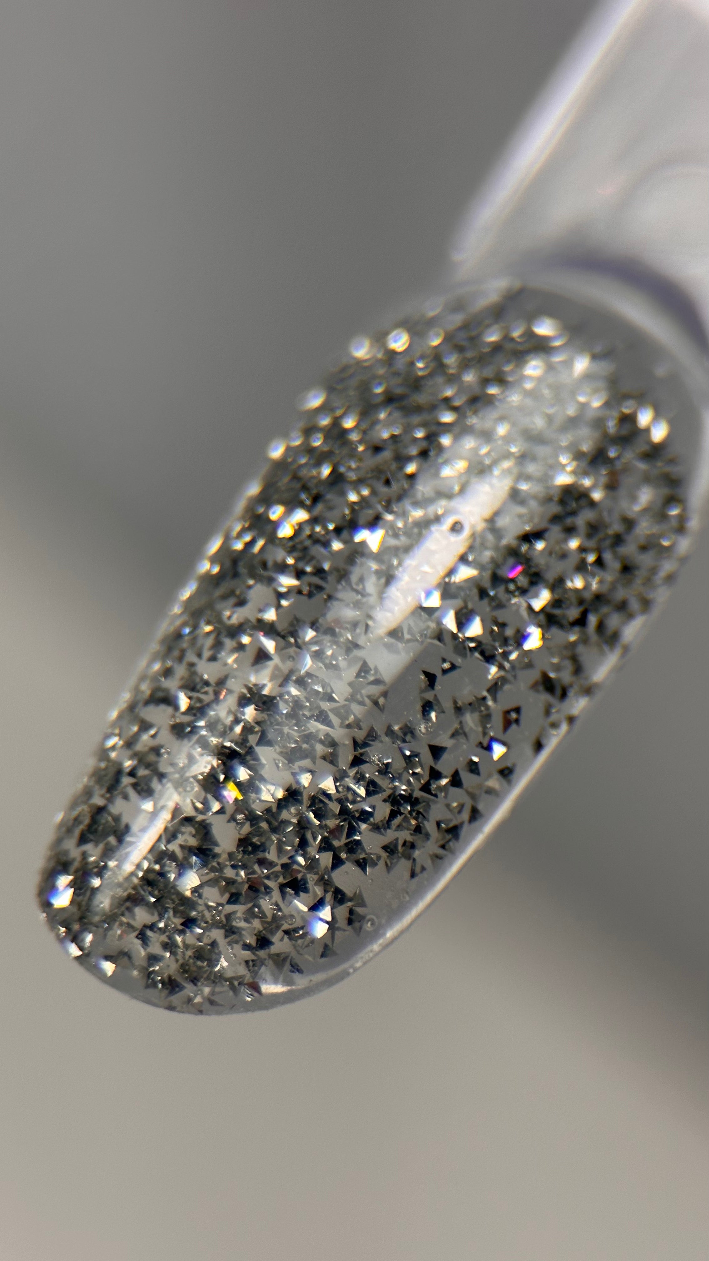 Get a show-stopping crystal nail look with our unique silver triangle nail art embellishments! These tiny silver nail triangles can be effortlessly mixed with gel or stuck on polygel, adding a stunning crystal nail effect that sparkles from every angle. Perfect for creating luxury nail designs at home or in the salon, these silver nail decorations bring an eye-catching shine and glamour to any nail art look. Whether you’re a pro or a DIY enthusiast, our silver triangles help you achieve a crystal-inspired m