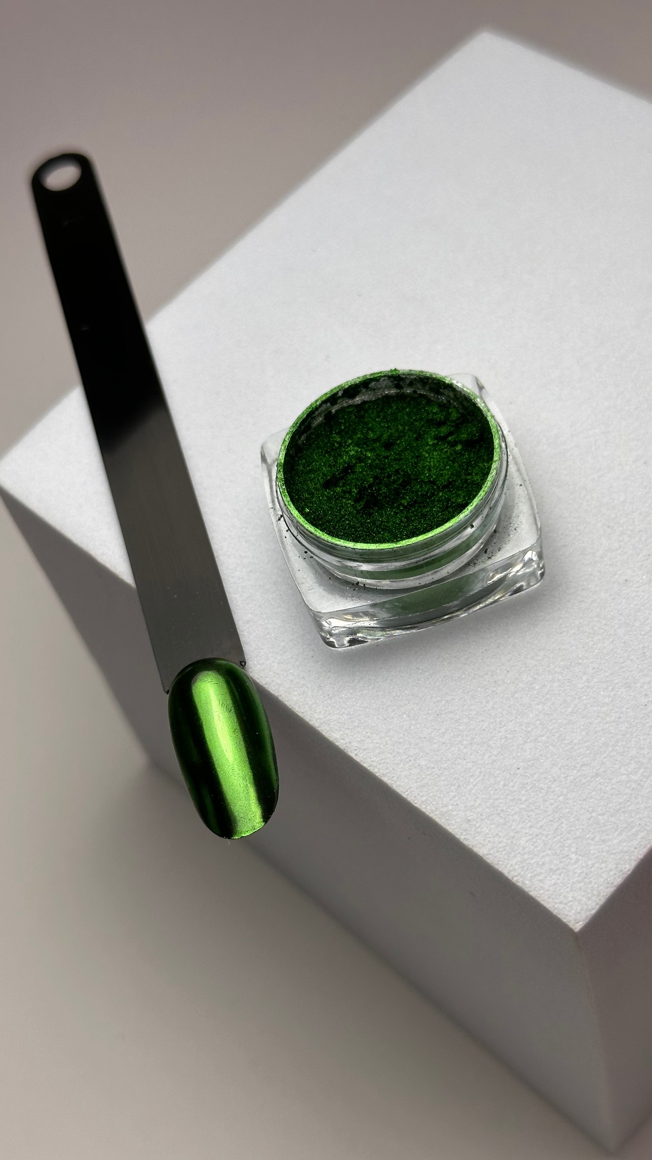 "MuseGel Metallic Green Chrome Powder in jar for high-shine nail effects"