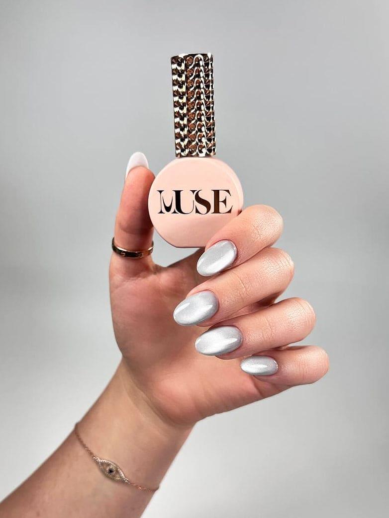 Cat Eye Silver Gel Polish is your go-to for creating dynamic, eye-catching nail designs with a professional finish. This luxurious metallic silver shade, infused with ultra-fine magnetic particles, allows nail artists to craft mesmerizing effects that shimmer and shift with every angle. From sleek and minimalist to bold and dramatic, the possibilities are endless with Muse’s Cat Eye Silver.