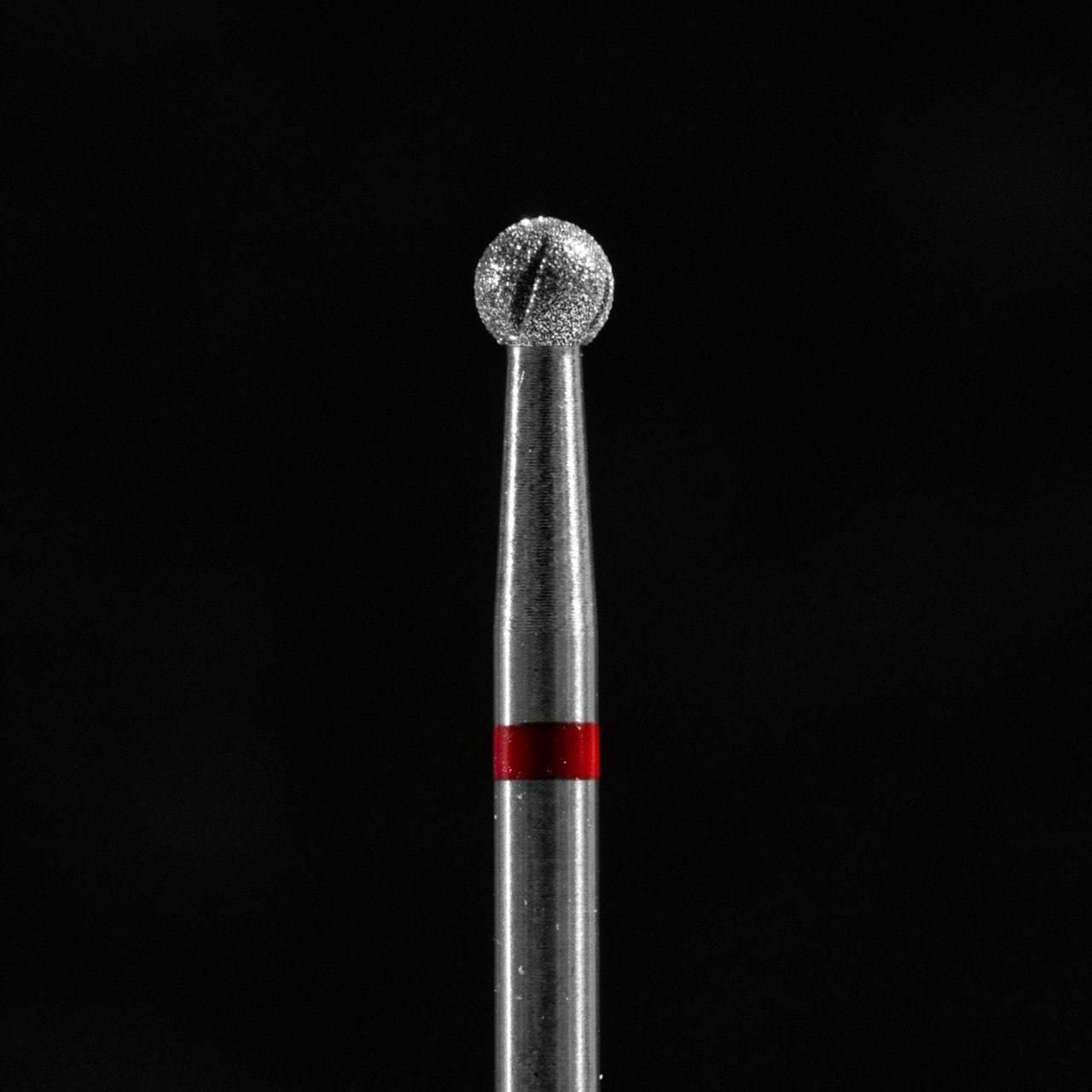 Metal tool with a textured head and red band on a black background, manicure, Pedicure, Cuticle