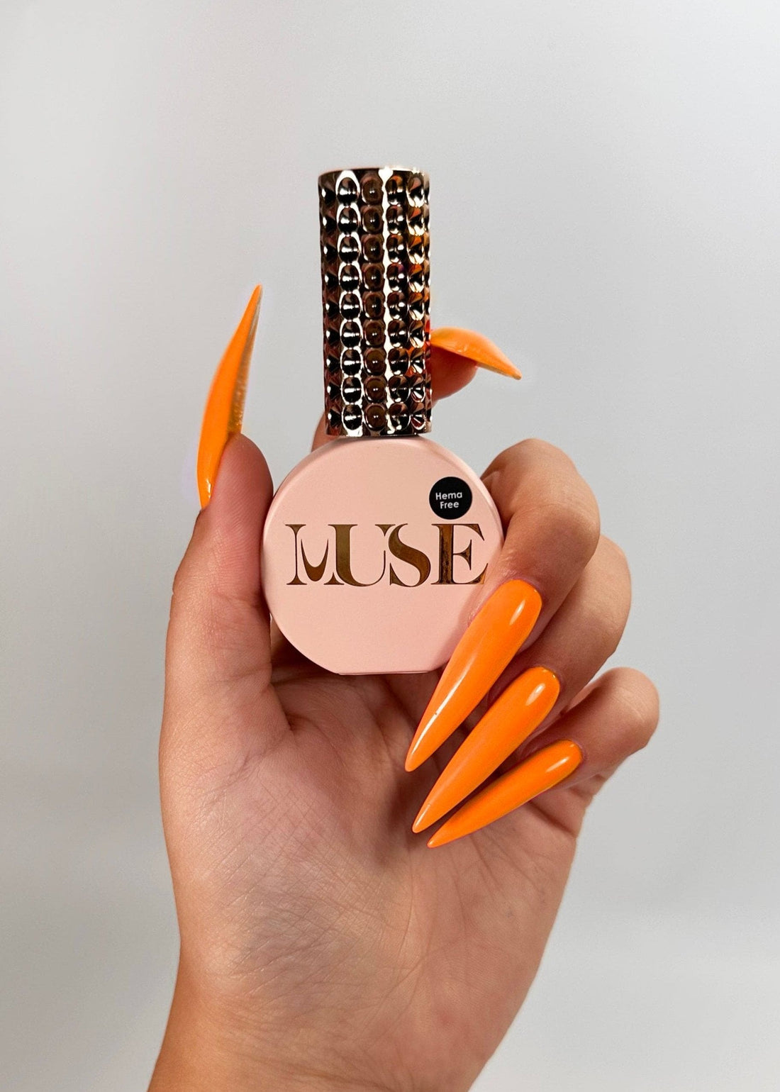 Nails featuring intricate designs created with Muse Gel’s Classic Orange Gel Polish, showcasing its high pigmentation and smooth, precise application ideal for nail art.