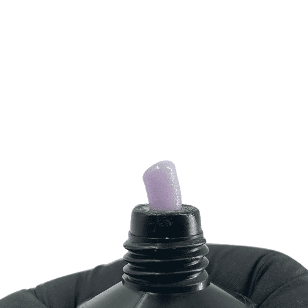 The tube's cap is removed, revealing a bead of lavender polygel on the dispenser tip.