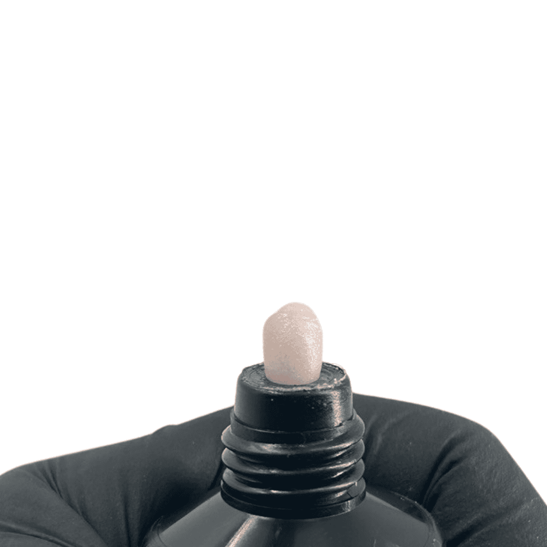 The tube from the first image with its cap off, showing a soft white gel with a shimmer texture oozing from the opening.