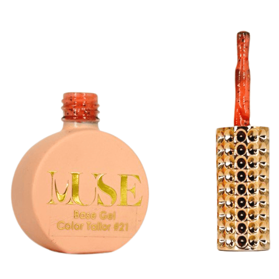 "A bottle of MUSE Base Gel in a peachy tone labeled Color Tailor #21 with the cap off, featuring a brush with a red-orange glittery handle and a gold-studded brush head."