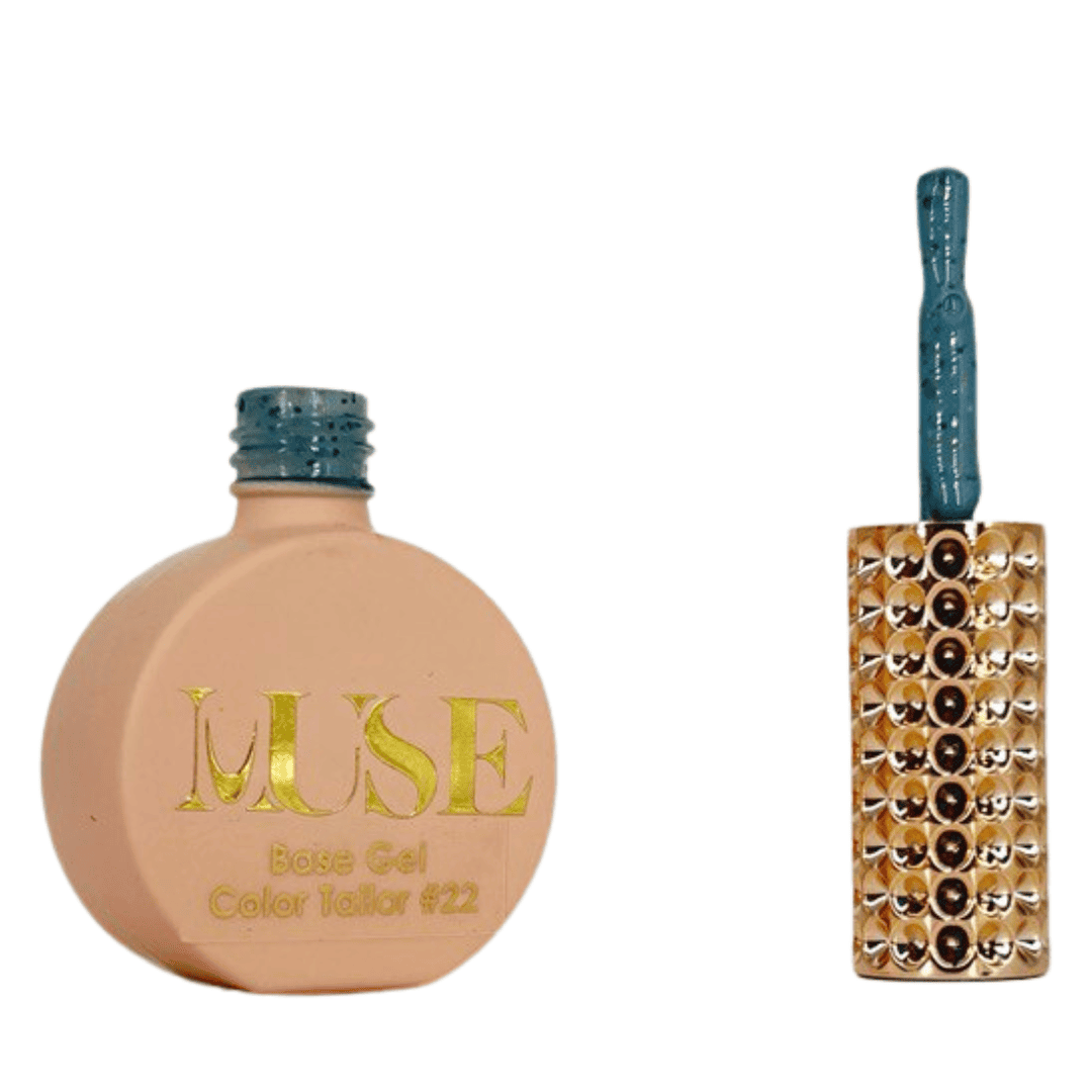 "A bottle of MUSE Base Gel in a light peach shade labeled Color Tailor #22 with the cap off, showcasing a brush with a blue glittery handle and a gold-studded brush head."