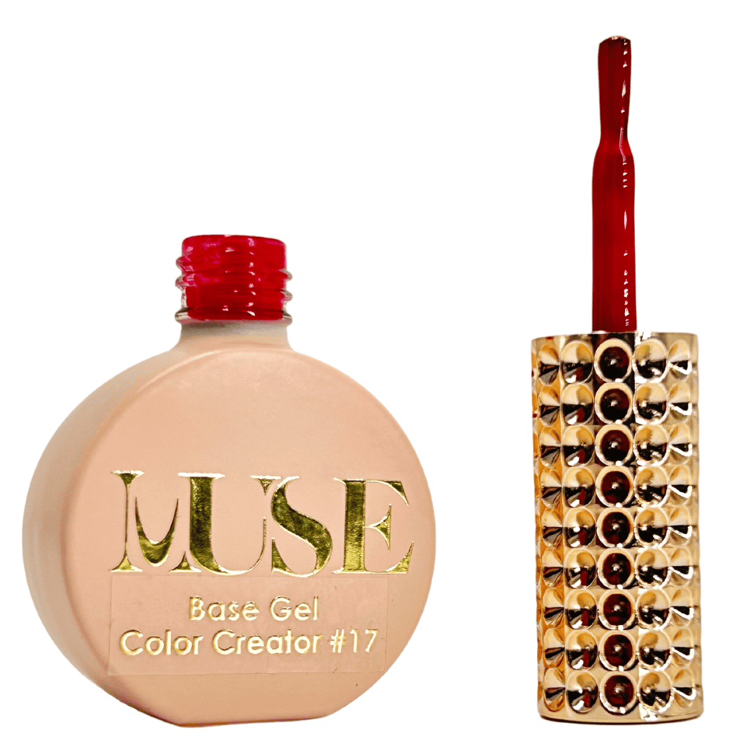 A bottle of cherry red nail base gel with the label "MUSE Base Gel Color Creator #17" is displayed alongside its brush with a streak of the same cherry red gel. The cap of the bottle is also cherry red, and the brush handle is decorated with a row of shiny rhinestones, suggesting an elegant and premium nail product.