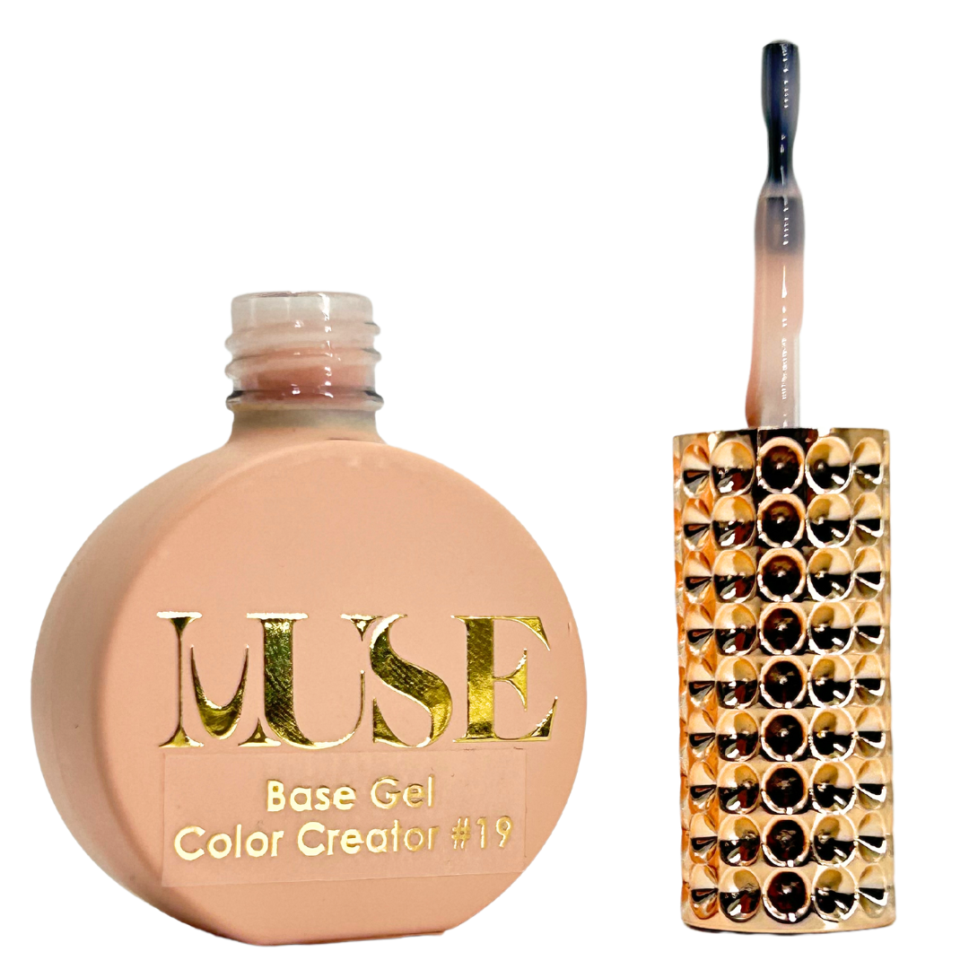 A bottle of MUSE Base Gel Color Creator #19 with a matching light nude cap and a brush handle adorned with crystals, ideal for a subtle and polished nail look.