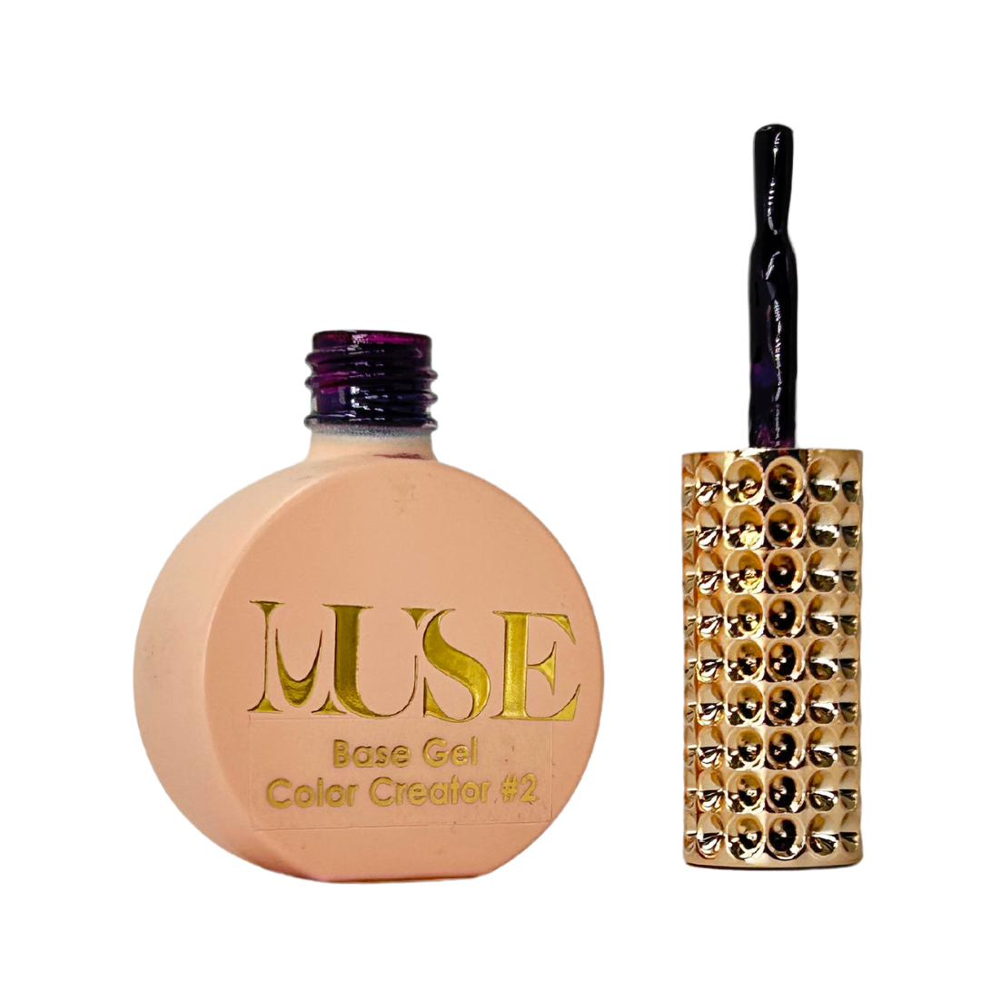  A bottle of MUSE Base Gel Color Creator #2 in dark purple with a luxurious gold-studded cap and a sleek brush applicator.