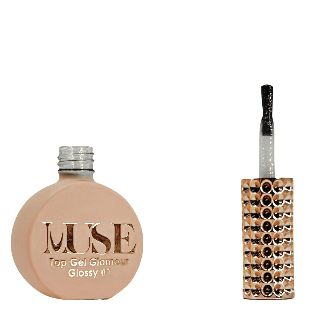 A bottle of MUSE Top Gel Glamour in Glossy #1, presented in a flat, round container with a matte peach finish. The screw cap is silver, and the brush applicator is designed with a clear handle that contains a glitter-filled interior, giving it a festive, sparkly appearance. The bottle's label showcases the MUSE logo in elegant gold lettering with the product details "Top Gel Glamour Glossy #1" below.
