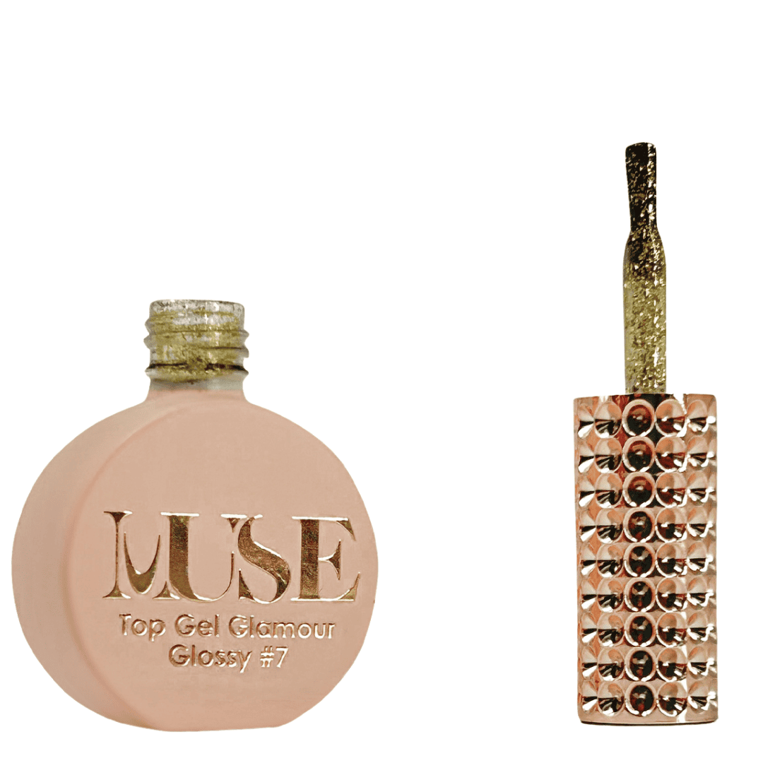 A bottle of MUSE Top Gel Glamour in Glossy #7, featuring a flat, round container with a matte peach finish. The cap is a gold glittery screw top, and the brush applicator has a clear handle filled with gold sparkles. The bottle's label is adorned with the MUSE logo in elegant gold lettering with the text "Top Gel Glamour Glossy #7" beneath.