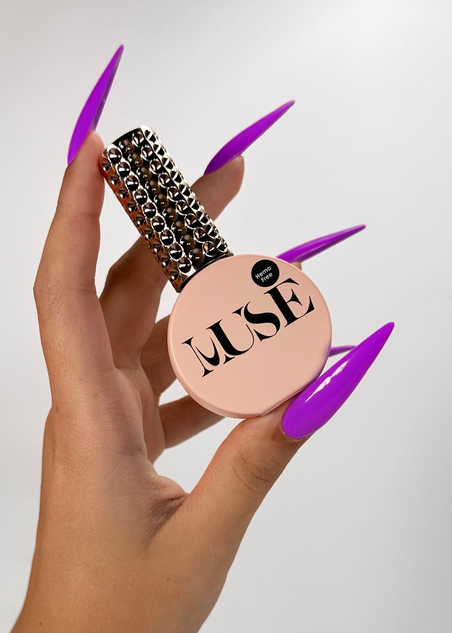 Nails featuring vibrant, cosmic designs created with Muse Gel’s Neon Purple Gel Polish, highlighting its rich pigmentation and glossy finish, perfect for salon-quality nail art.