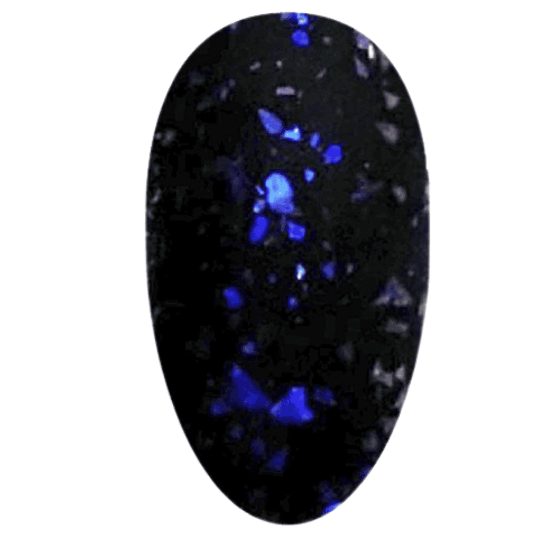 A digital illustration of a nail polish swatch that presents a matte black finish interspersed with blue glitter particles. The swatch is oval and demonstrates a flat, non-reflective surface that contrasts with the shiny specks of blue glitter, providing a cosmic, starlit effect against the matte backdrop.