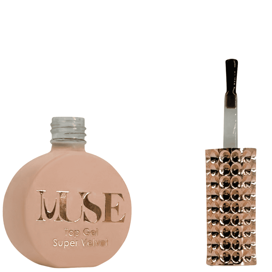 A bottle of MUSE Top Gel labeled "Super Velvet", featuring a flat, circular base with a matte peach finish. The cap is a clear, silver glitter screw top, and the brush applicator has a clear handle filled with glitter. The label on the bottle displays the MUSE logo in gold, with "Top Gel Super Velvet" written beneath it.