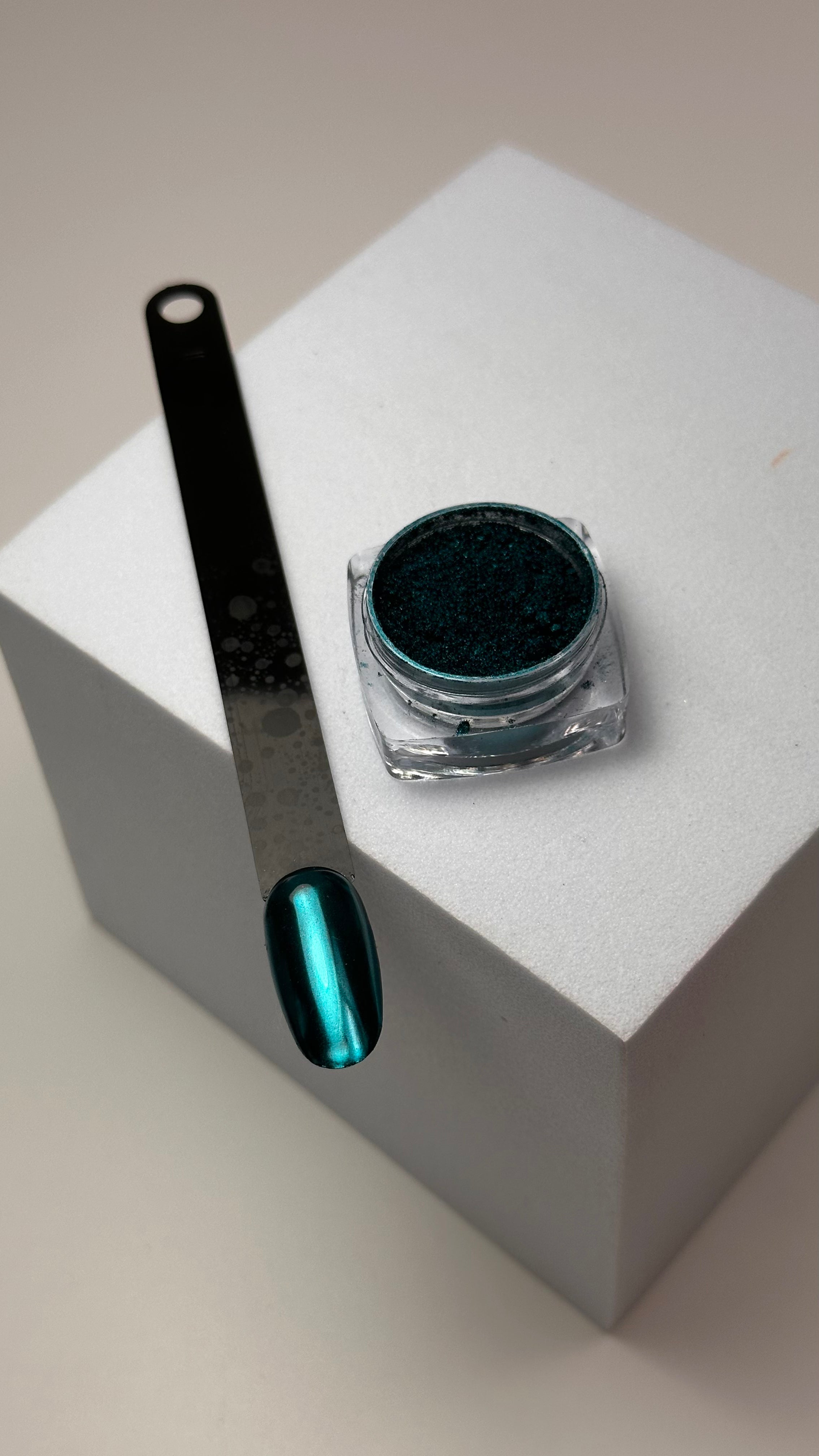 Close-up of nails with Muse Metallic Chrome Powder in Light Blue applied, showcasing a shiny, metallic finish.