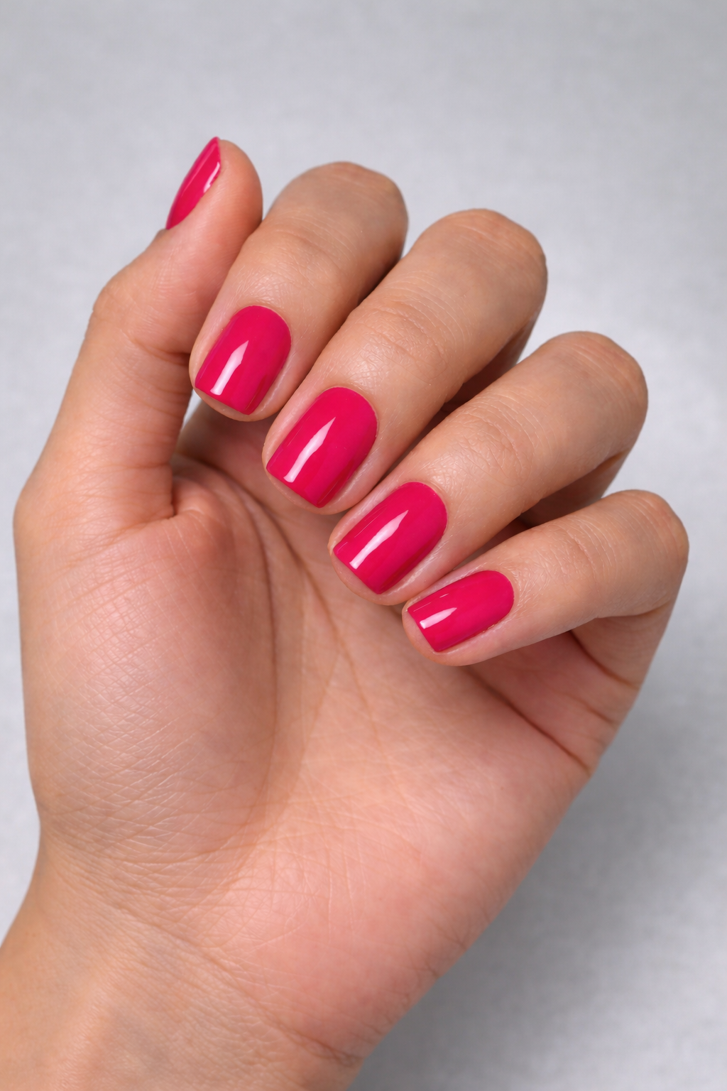 raspberry fuchsia gel polish manicure