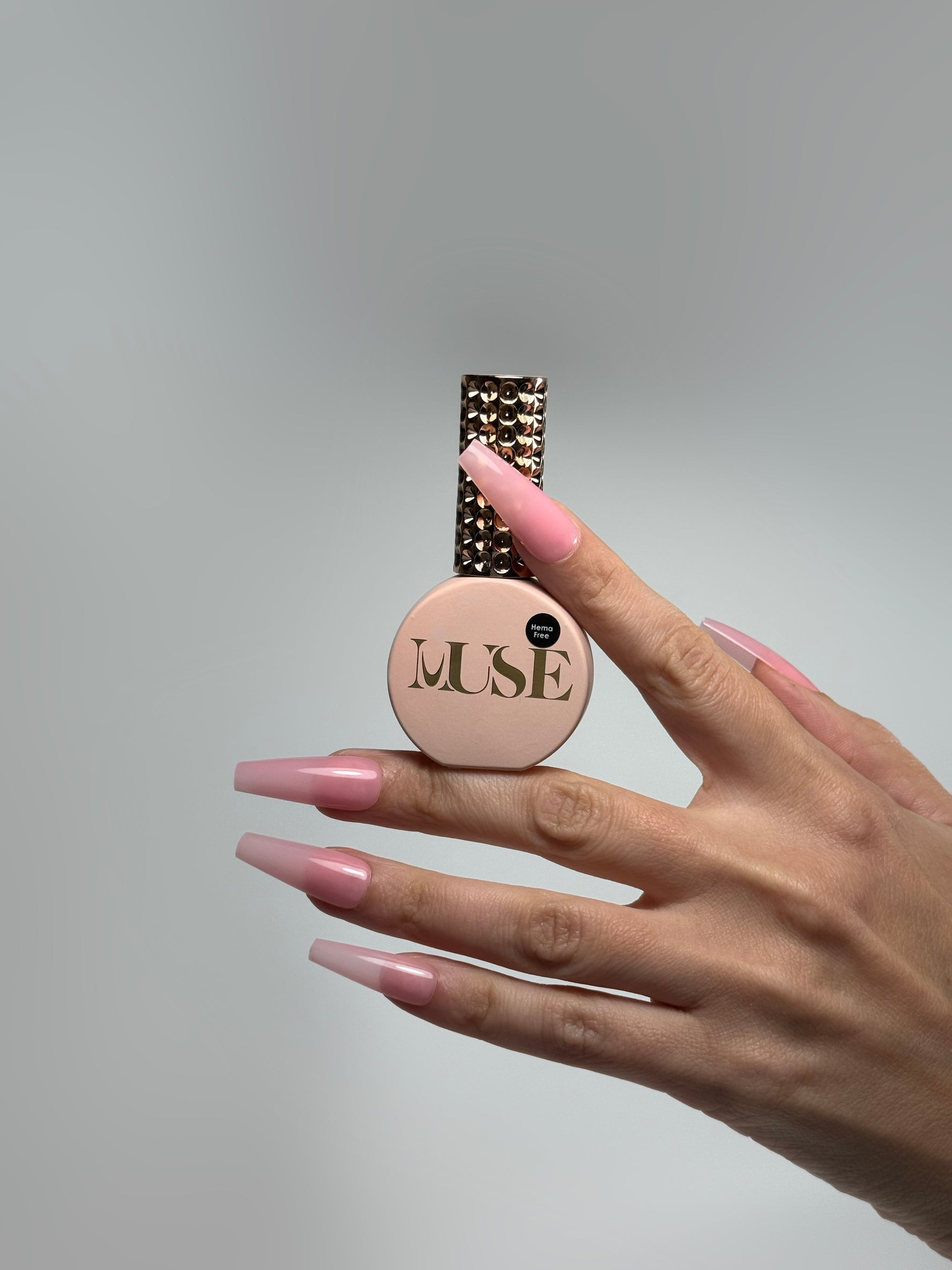 Long square nails painted with Muse Gel Polish #42 – Crystal Pink Veil, a sheer cool-toned pink gel ideal for soft natural overlays and elegant manicures.