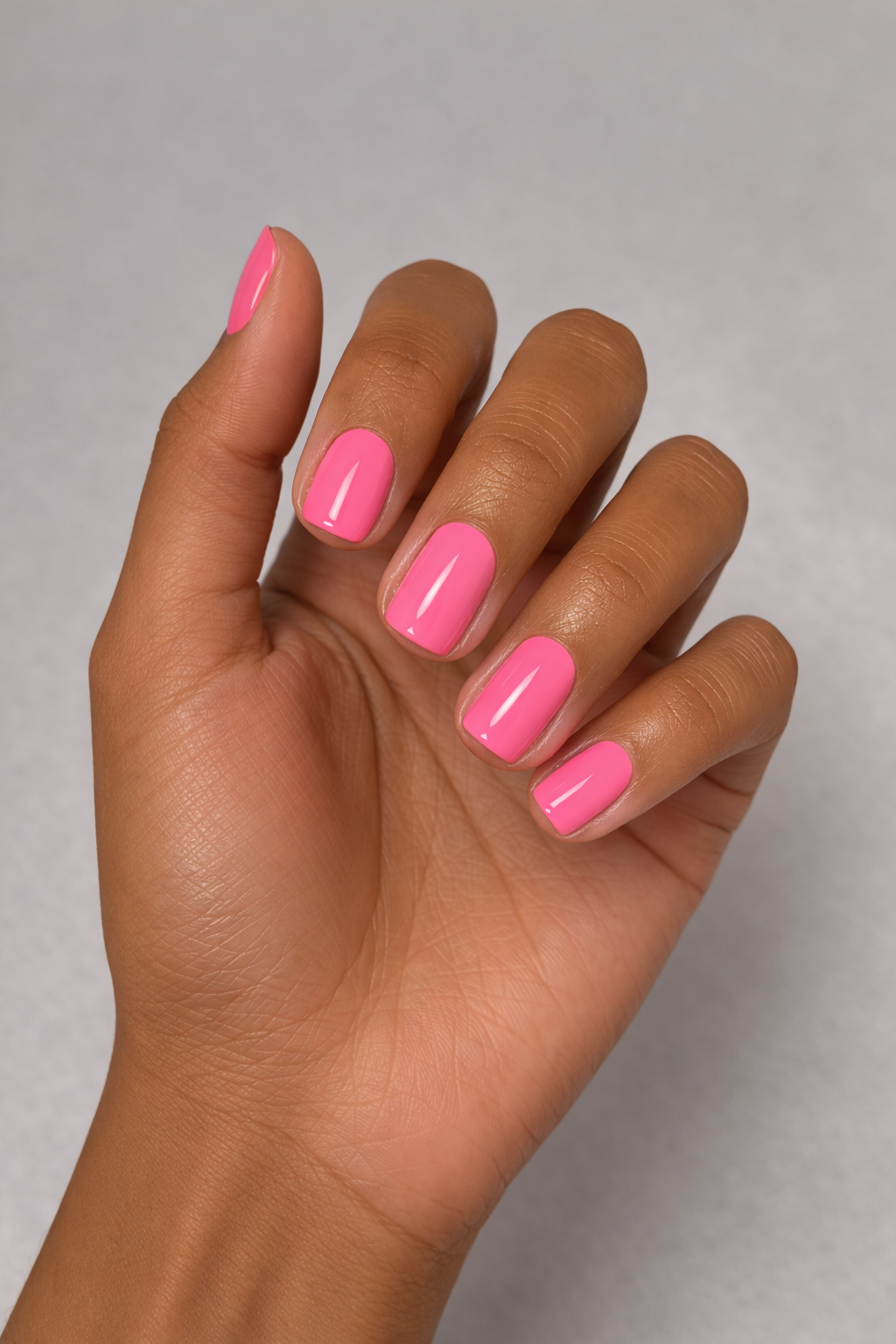 neon coral pink gel polish on short nails