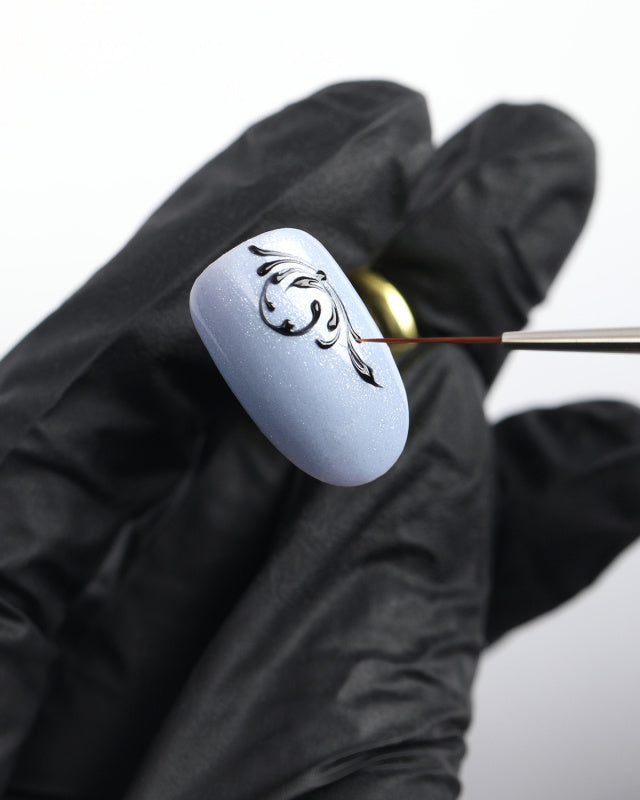 Professional nail art detail brush with soft synthetic bristles for precise line work and beginner-friendly application