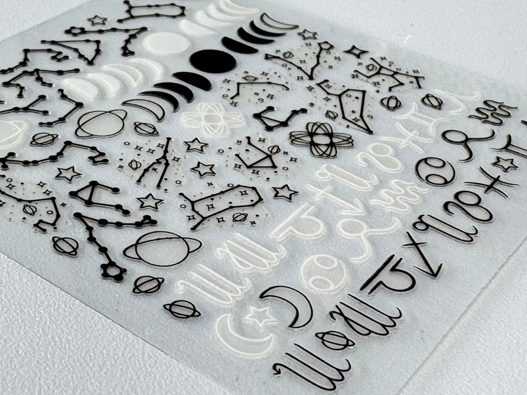 Zodiac symbol nail sticker detail close up