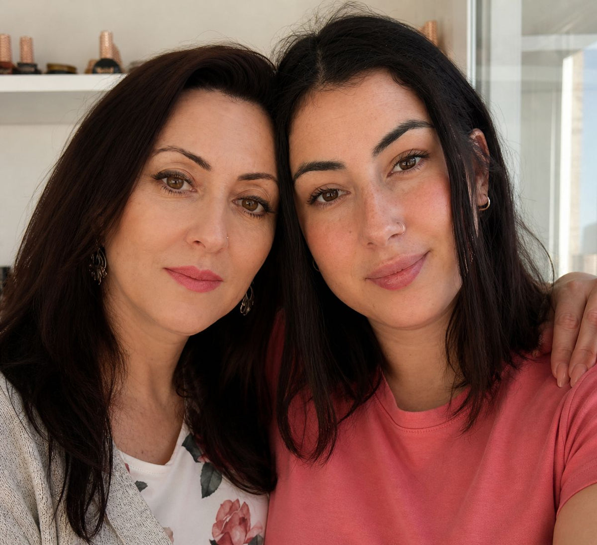 Betty Margulis and Alina Margulis, the founders of Muse Gel, standing together in a professional portrait. Family-owned Canadian nail brand specializing in HEMA-free and TPO-free gel nail products for nail technicians, salons, and nail enthusiasts across Canada and the USA.