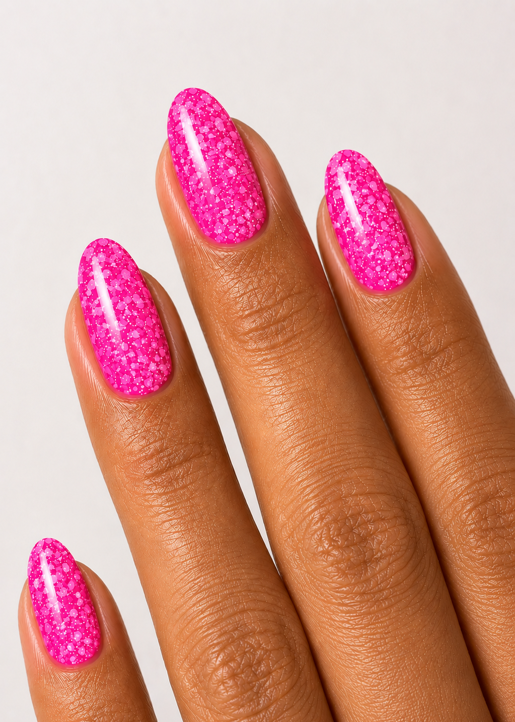 Muse Gel Creator Base #26 neon pink glitter color base gel on almond-shaped nails featuring vibrant fluorescent pink sparkle and reflective glitter finish, professional soak-off color base gel for summer, festival, and statement nail designs in Canada