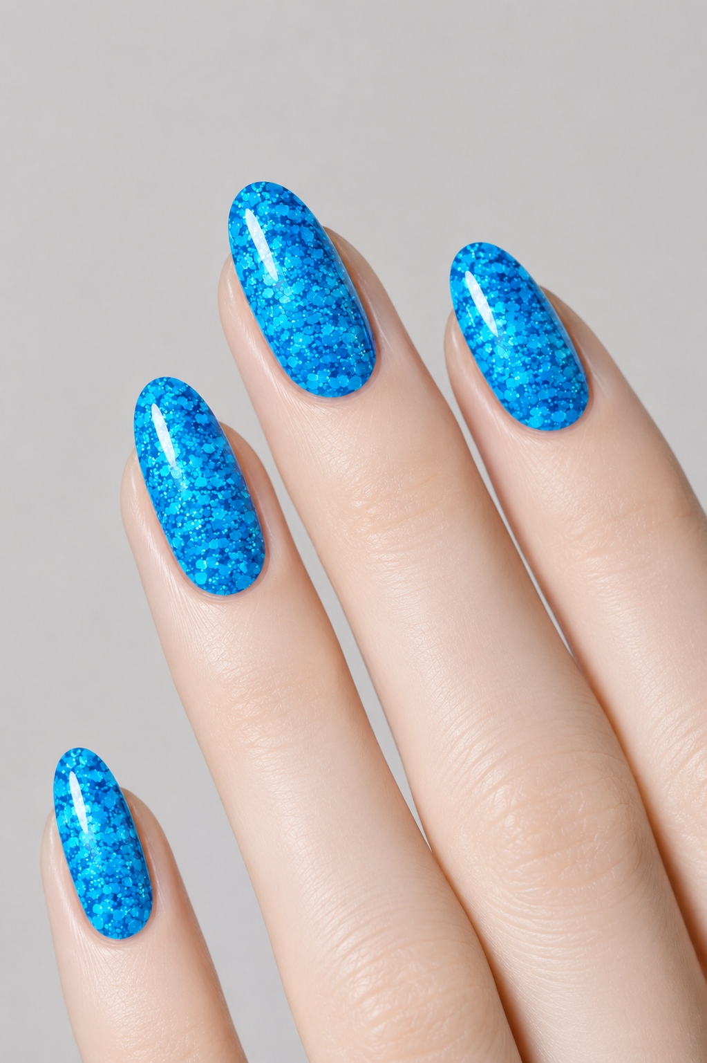 Muse Gel Creator Base #27 blue glitter color base gel on almond-shaped nails with vibrant electric blue sparkle and reflective glitter finish, professional soak-off color base gel for long-lasting nail designs in Canada