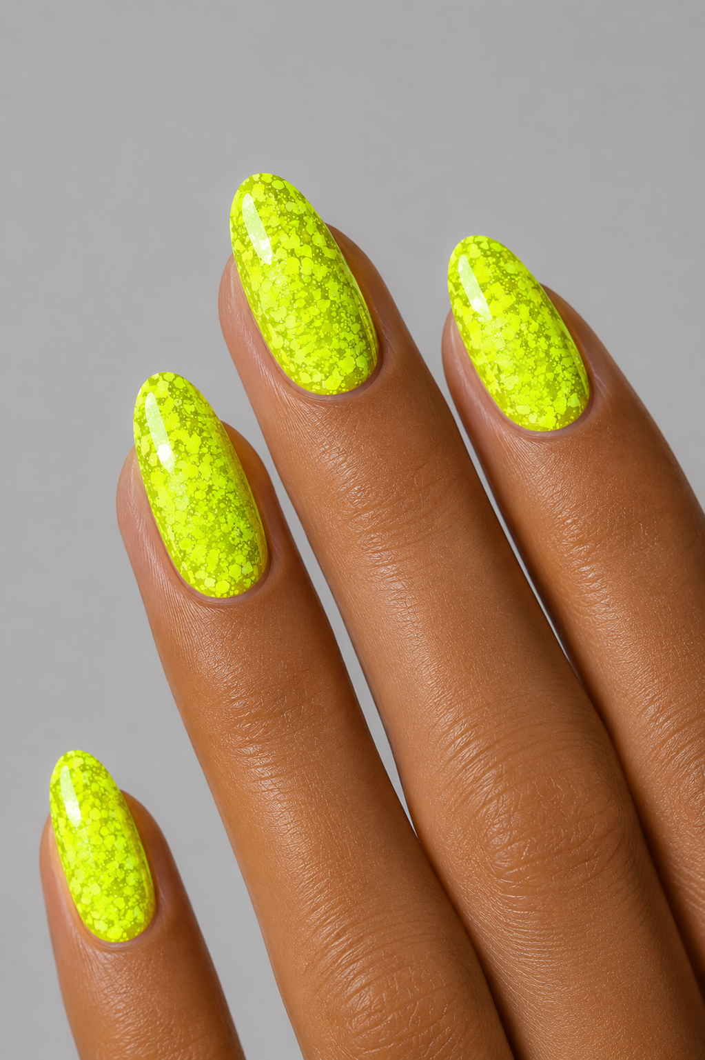 Muse Gel Creator Base #28 neon yellow glitter color base gel on almond-shaped nails featuring bright fluorescent yellow-green sparkle and reflective glitter finish, professional soak-off color base gel for summer nail designs in Canada