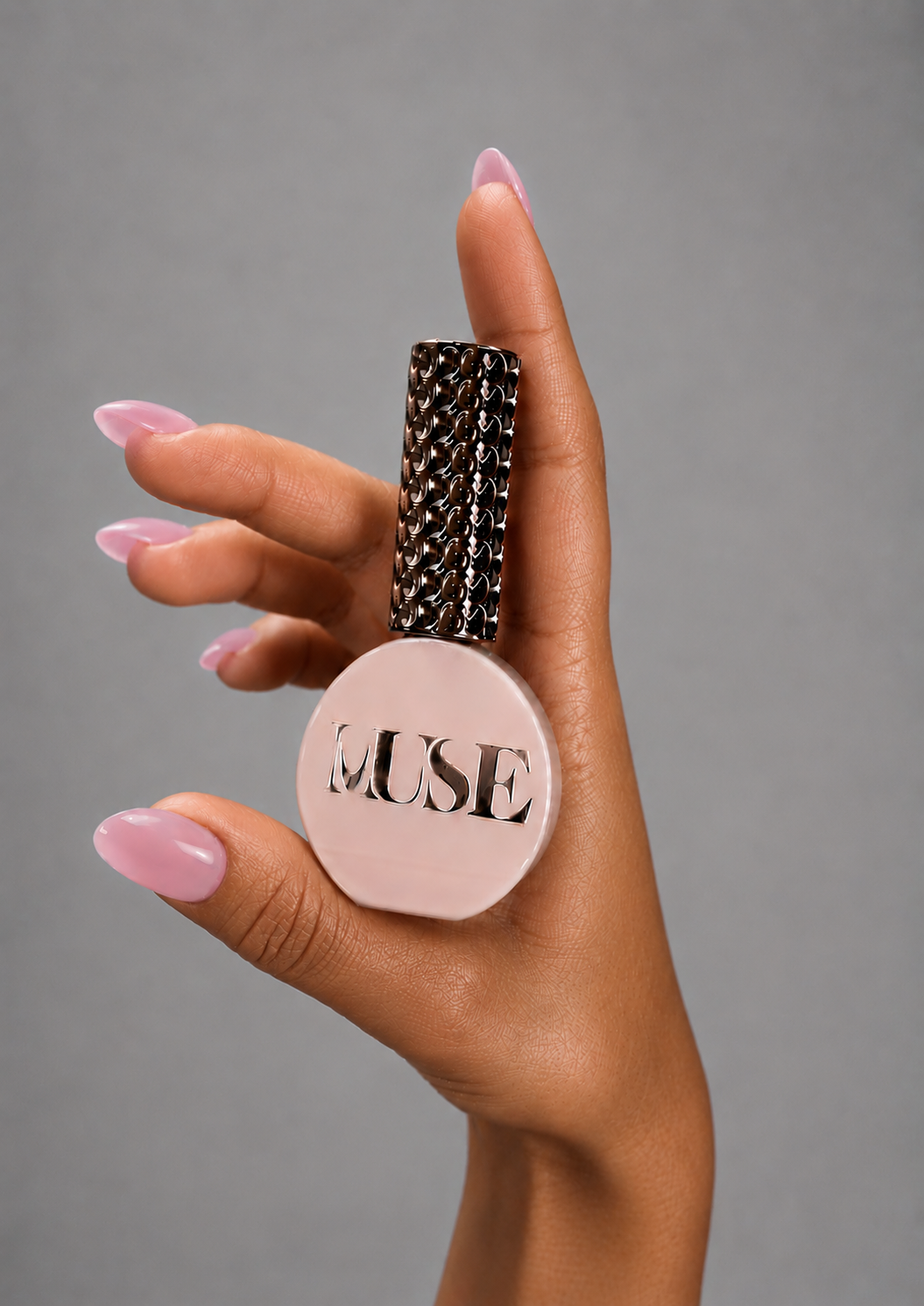 Muse Gel Creator Base #34 dusty rose pink coloured base gel on semi-transparent almond-shaped nails. Professional pink builder color base with a natural glossy finish for BIAB overlays, structured manicures, and salon nail enhancements in Canada.