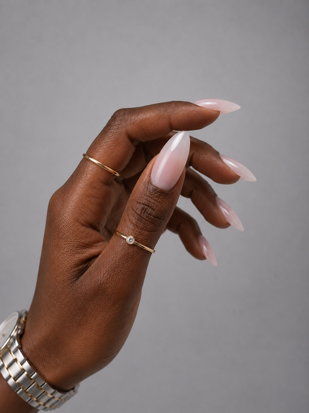 Muse Gel Creator Base #35 Milky colour base gel on semi-transparent almond-shaped nails with a soft milky white finish. Professional self-leveling color base for natural overlays, BIAB manicures, and salon nail enhancements in Canada.