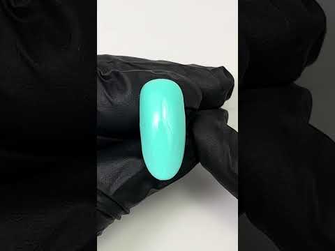 Glossy swatch of Vibrant Turquoise Nail Base Gel with a bold, bright finish.
