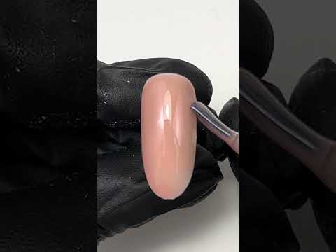 Swatch of Warm Nude Brown Nail Base Gel showcasing a smooth, glossy finish.