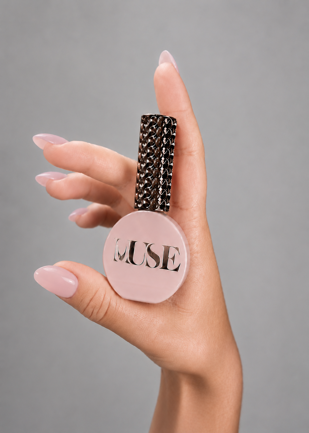Muse Gel Creator Base #19 Light Nude Pink color base gel on elegant almond-shaped nails. Semi-transparent nude pink gel polish with a natural milky finish, ideal for overlays, BIAB manicures, and professional salon nail enhancements in Canada.